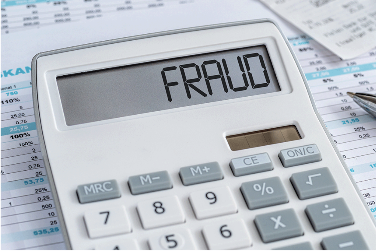 the word fraud spelled out in a calculator.