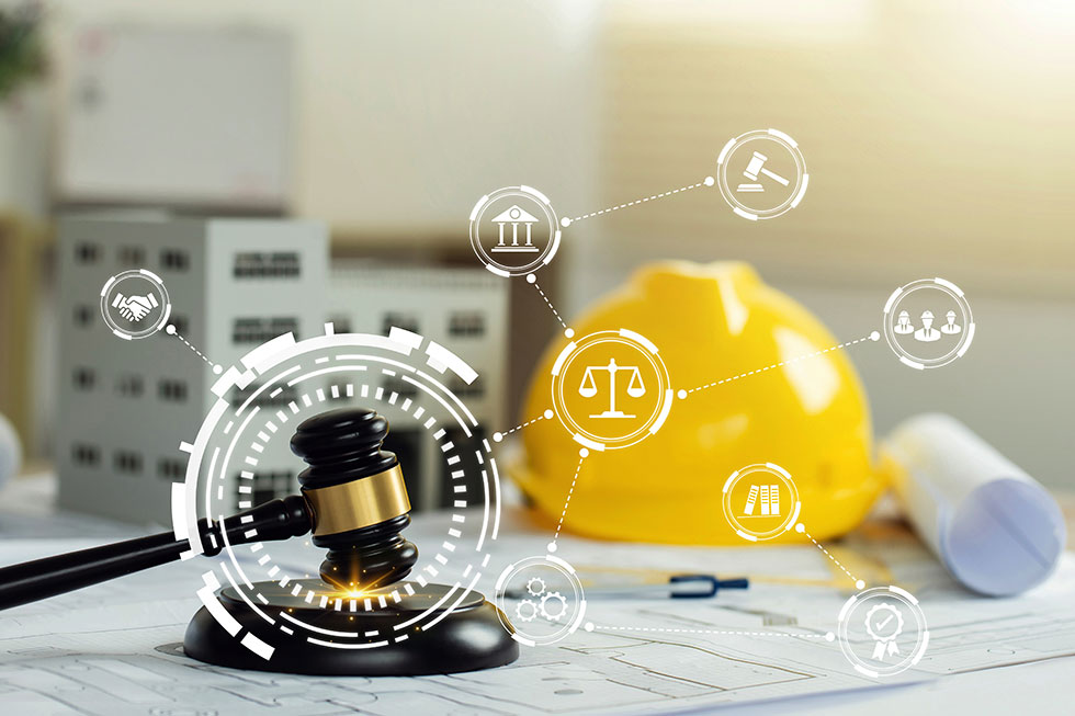 Construction law concept. judge gavel on building blueprint plans with a yellow safety helmet and building model.